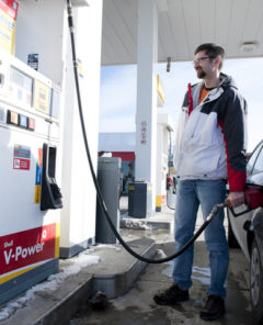 man pumping gas