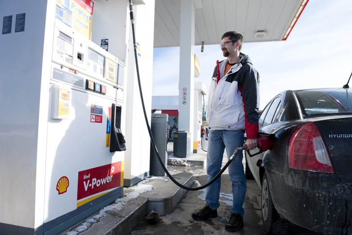 man pumping gas