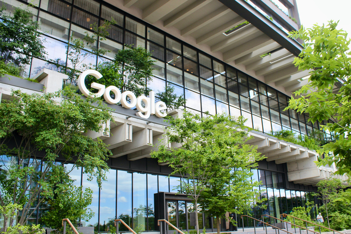 Green facade of the Google headquarters at St. John's Terminal in Hudson Square, NYC